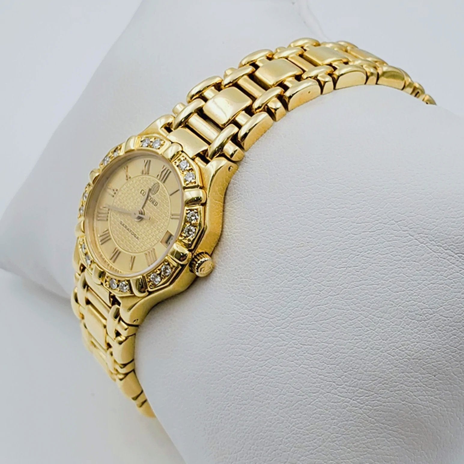 Ladies Concord Sarento 24mm Solid 18K Yellow Gold Wristwatch with Roman Numeral Gold Dial & Diamond Bezel. (Pre-Owned)