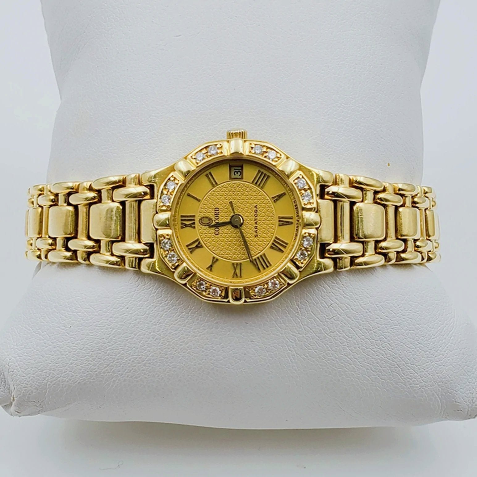 Ladies Concord Sarento 24mm Solid 18K Yellow Gold Wristwatch with Roman Numeral Gold Dial & Diamond Bezel. (Pre-Owned)