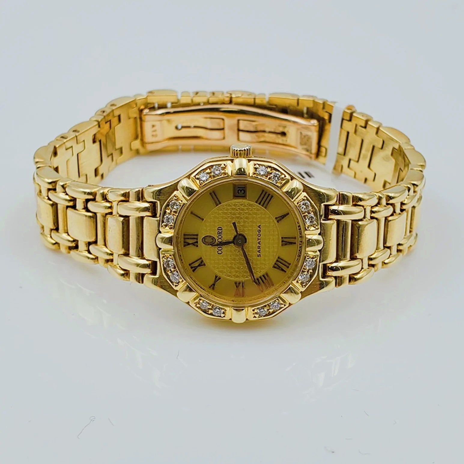 Ladies Concord Sarento 24mm Solid 18K Yellow Gold Wristwatch with Roman Numeral Gold Dial & Diamond Bezel. (Pre-Owned)