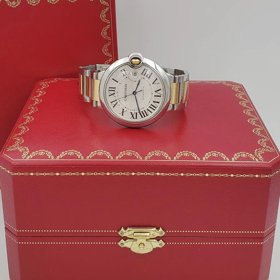 Men's Cartier 42mm Ballon Bleu Two Tone 18K Yellow Gold / Stainless Steel Wristwatch with Roman Numeral Silver Dial & Smooth Bezel. (NEW W2BB0031)